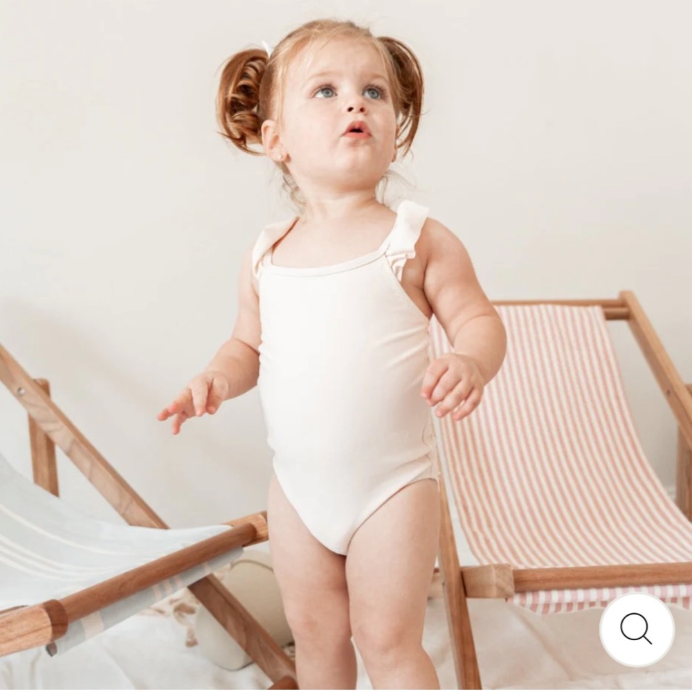Ivory baby swimsuit for twins. Can be sold individually or as a set.